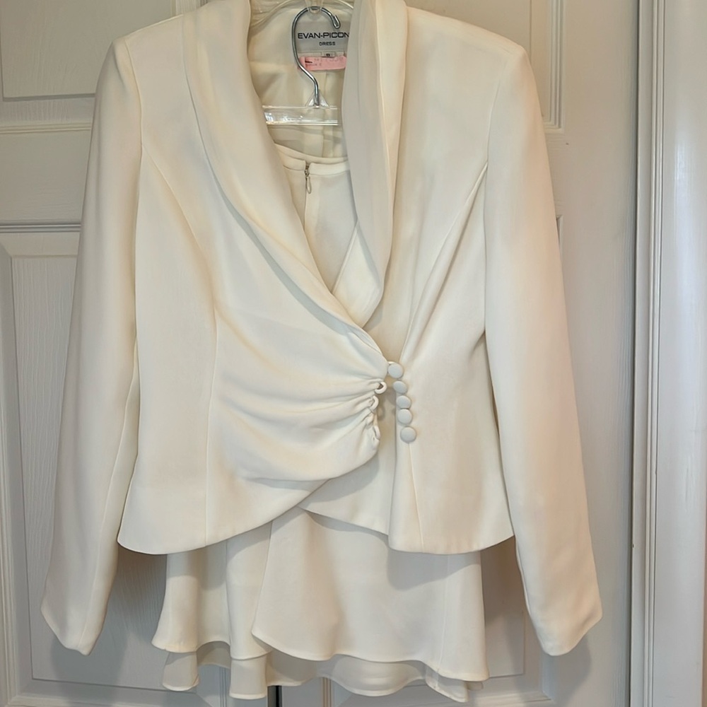 Cream colored two piece skirt suit would be perfect for a wedding event